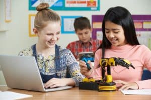 Two girls studying robotics in a Computer Science lesson